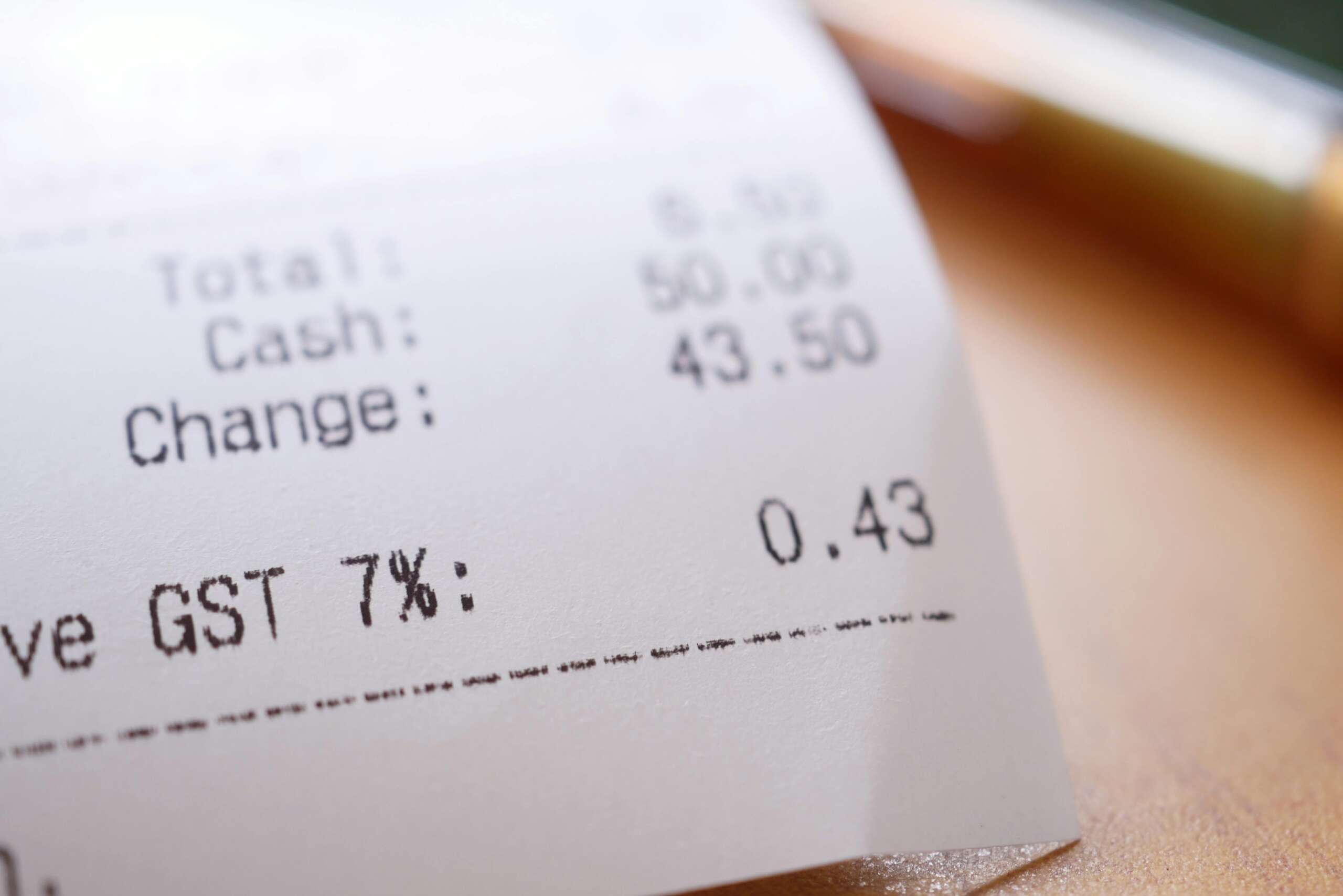 Receipt showing hidden fees and GST charges on food order